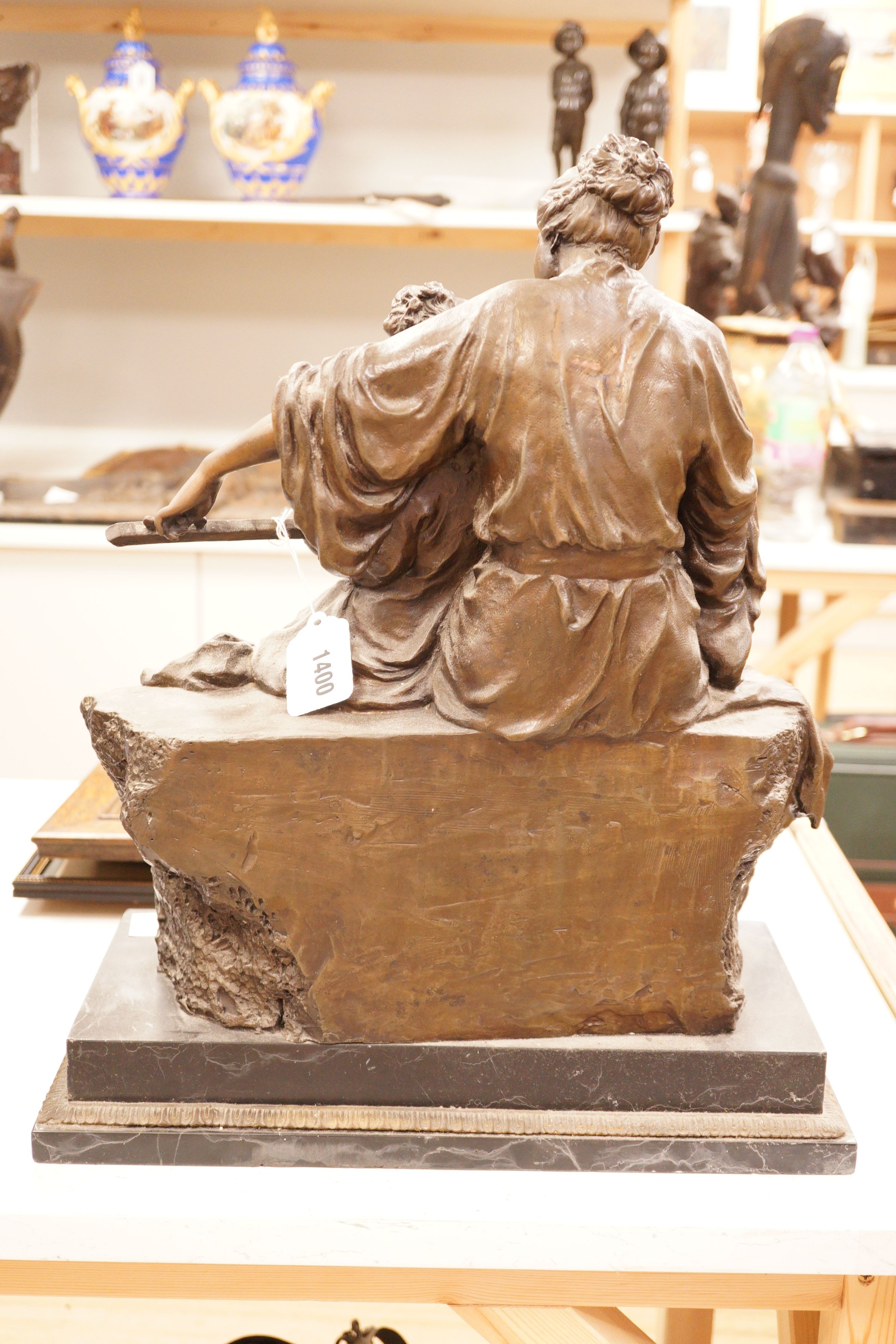 A large bronze figural group, 'learning to play', 51cm tall